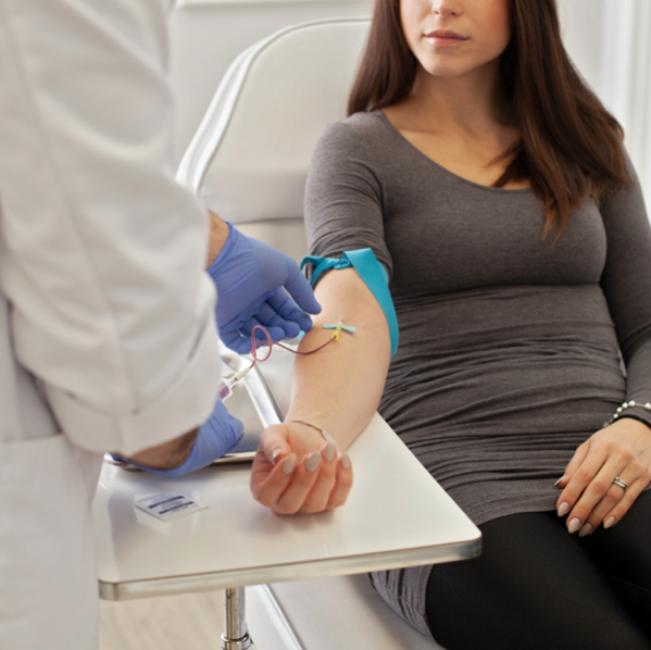 phlebotomist drawing blood for women