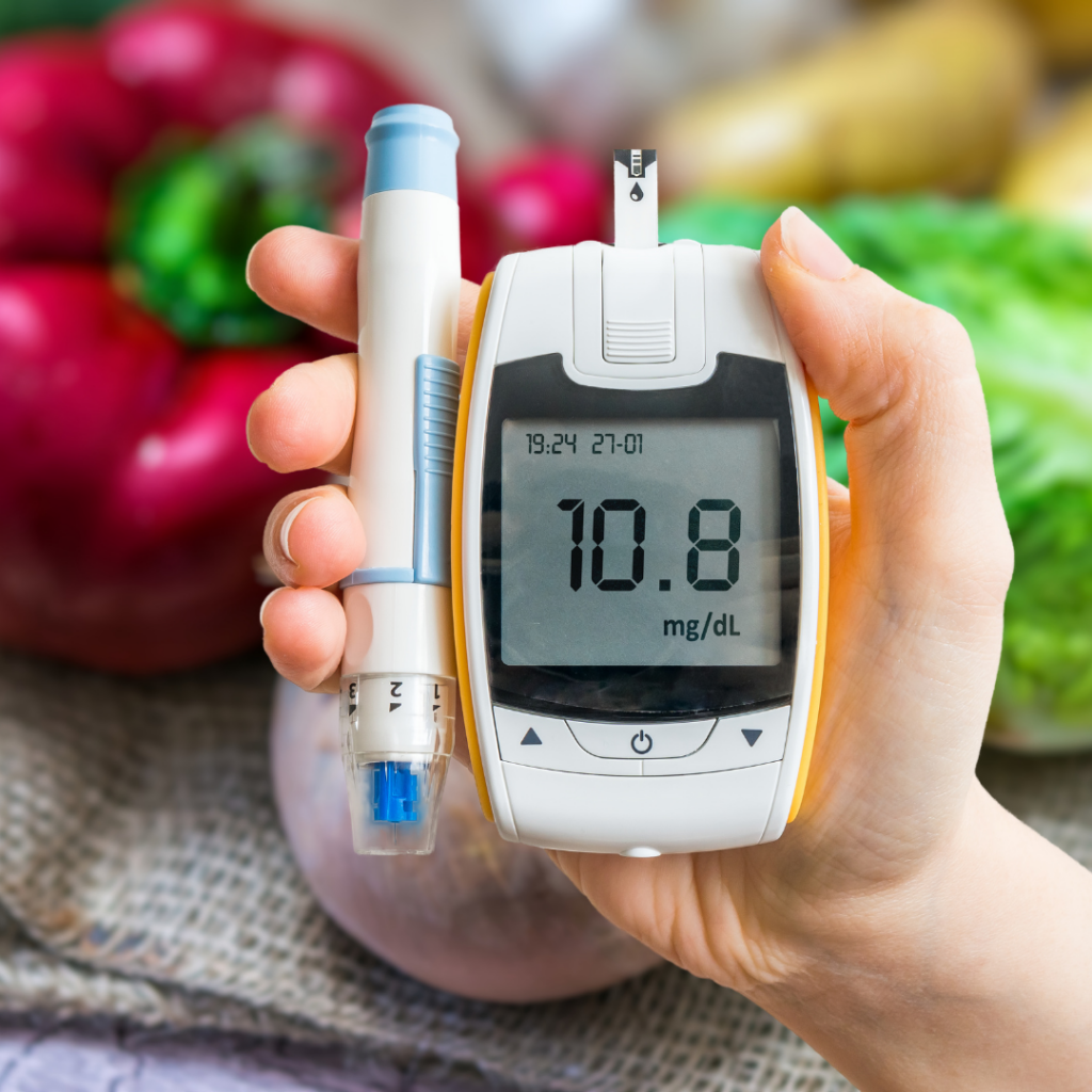 hand holding a glucose monitor 