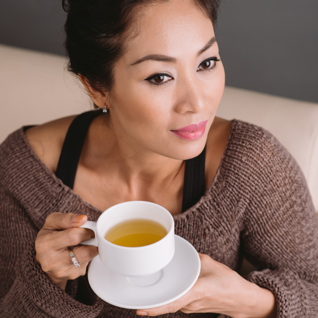 man drinking green tea