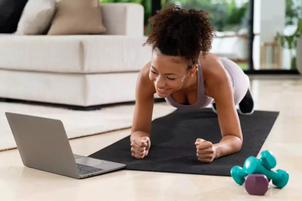 Sport training lifestyle and fitness concept portrait of beautiful happy african american woman exercising with jumping rope 