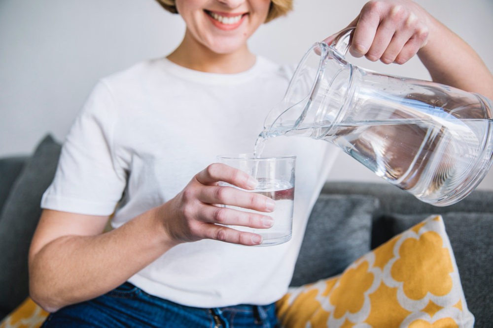 photo crop woman pouring water