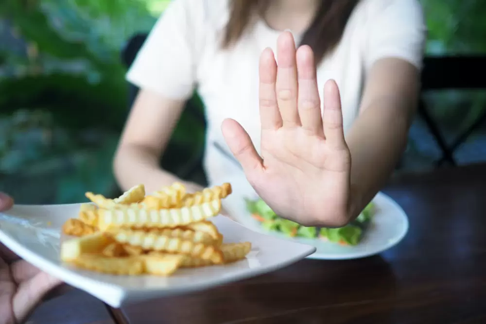 women refuse to eat fried or french fries for weight loss and good health