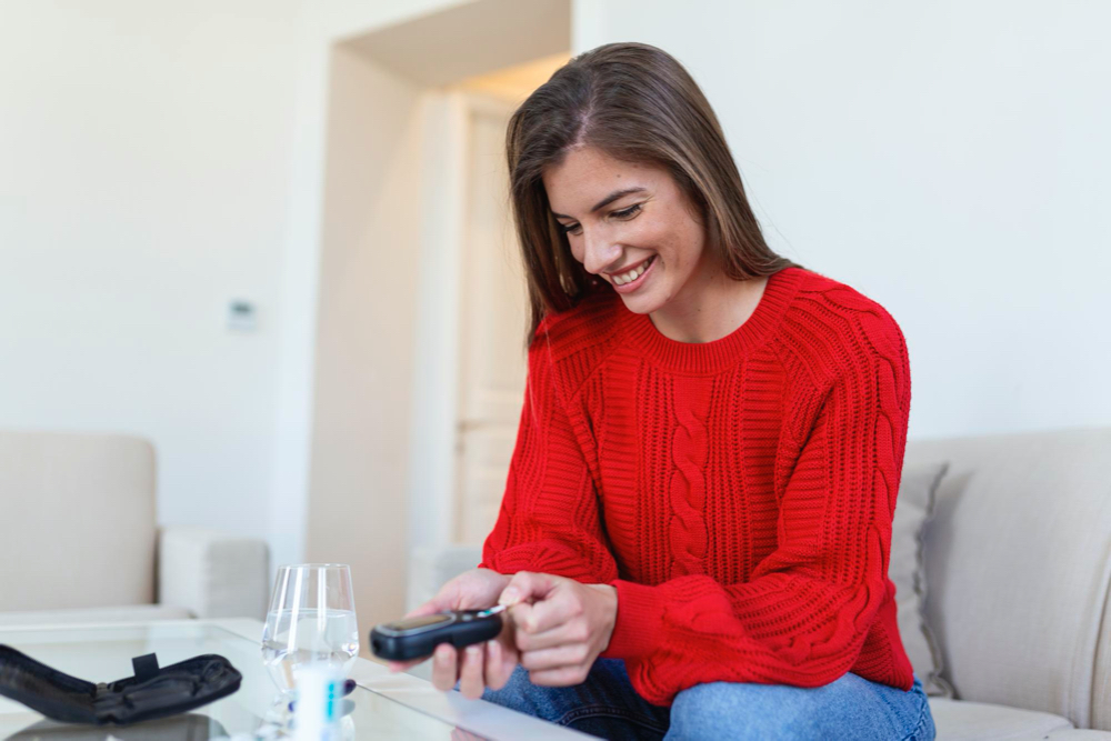 https://cdn.personalabs.com/wp-content/uploads/2023/07/woman-using-lancelet-finger-woman-doing-blood-sugar-test-home-living-room.jpg