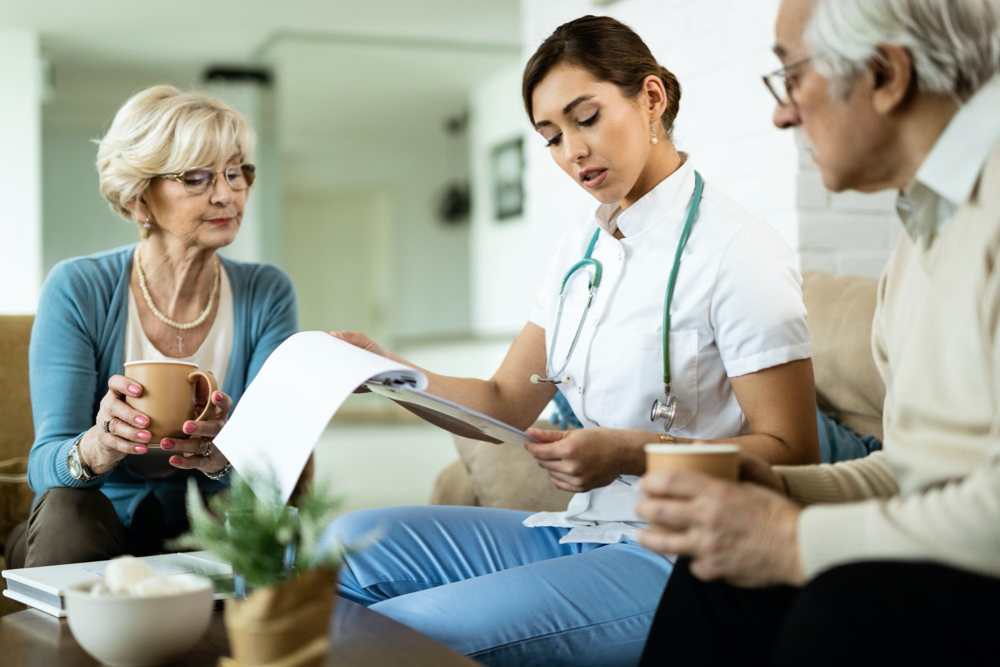 photo young healthcare worker and senior couple analyzing medical test results during home visit