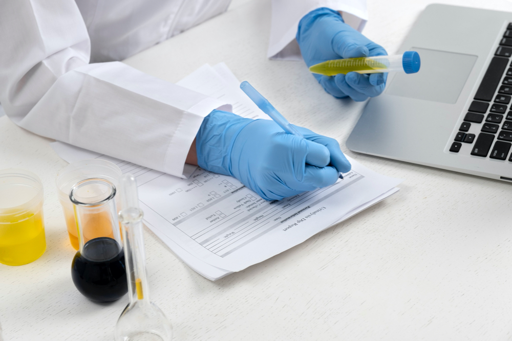 photo lab doctor performing medical exam of urine