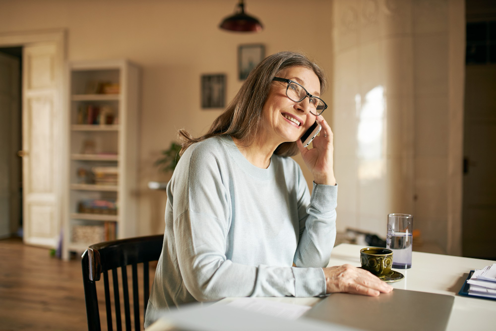 expressive senior female posing indoor on phone